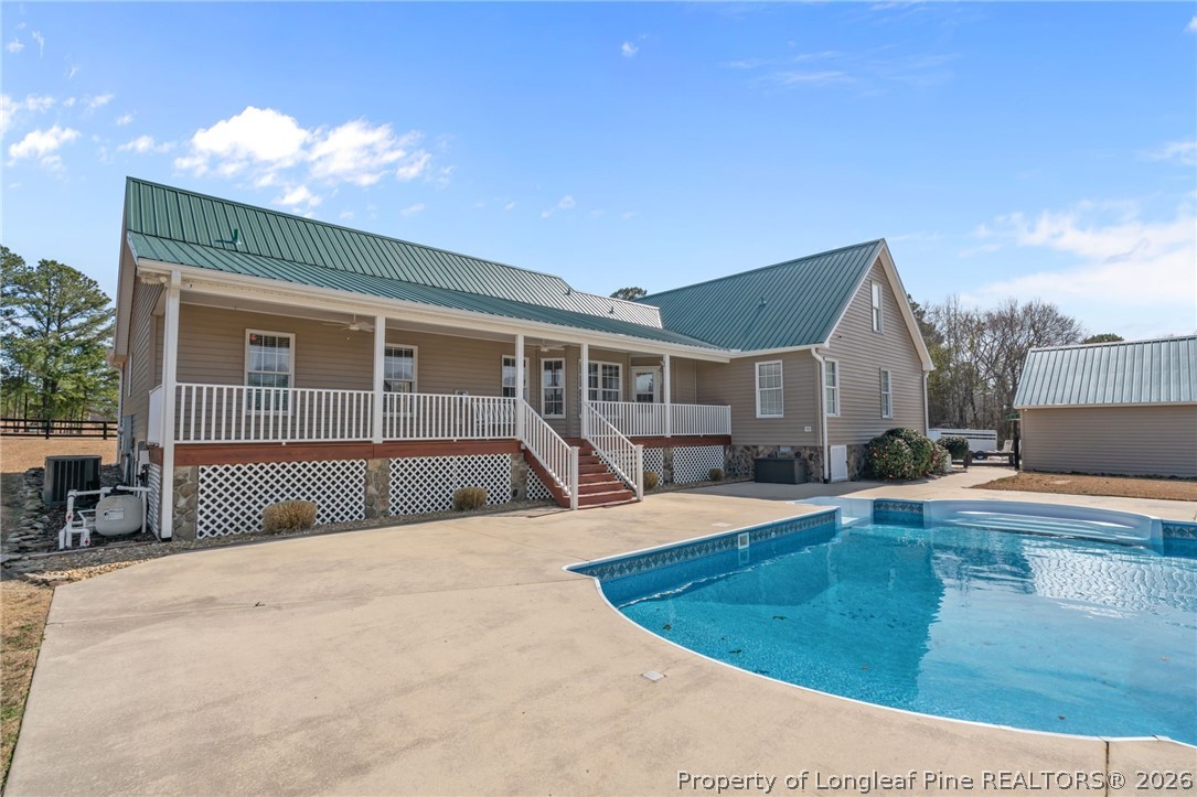 4240 Nicholson Road Cameron, NC 28326 - Photo 43 of 49 a view of a house with swimming pool and sitting area