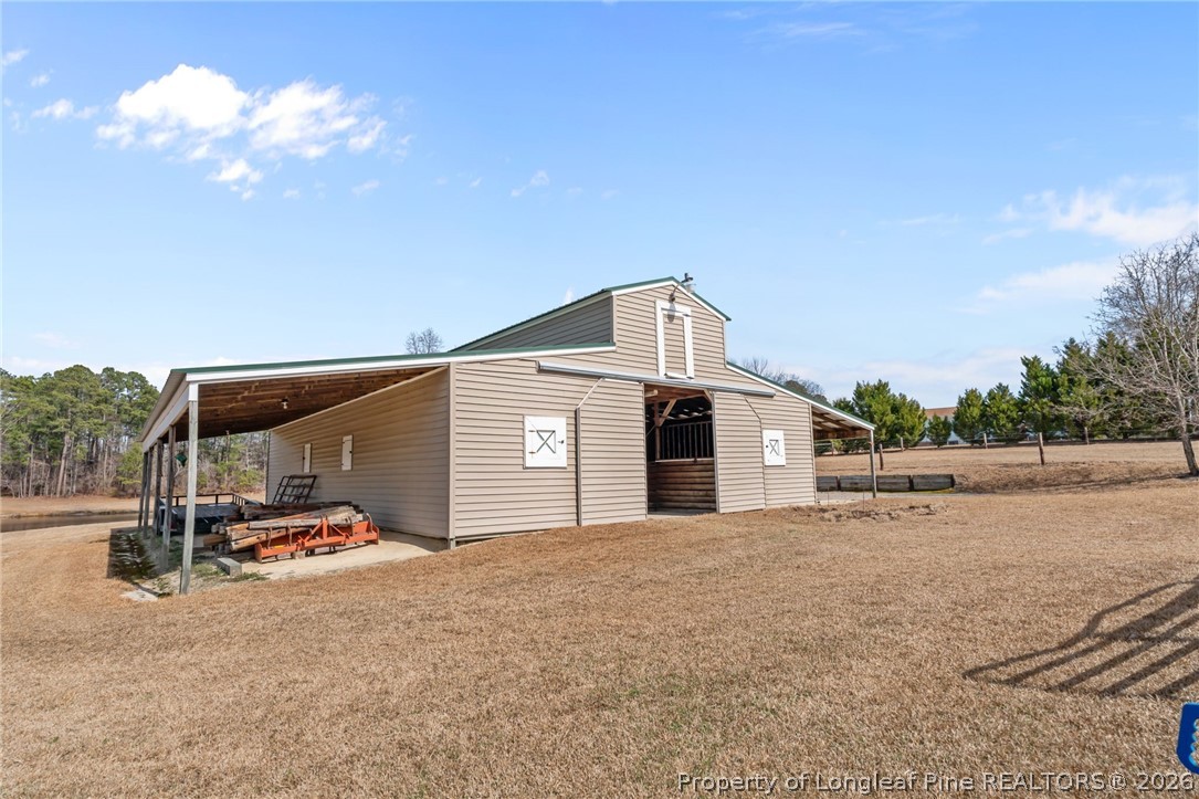 4240 Nicholson Road Cameron, NC 28326 - Photo 48 of 49 a view of a house with a yard