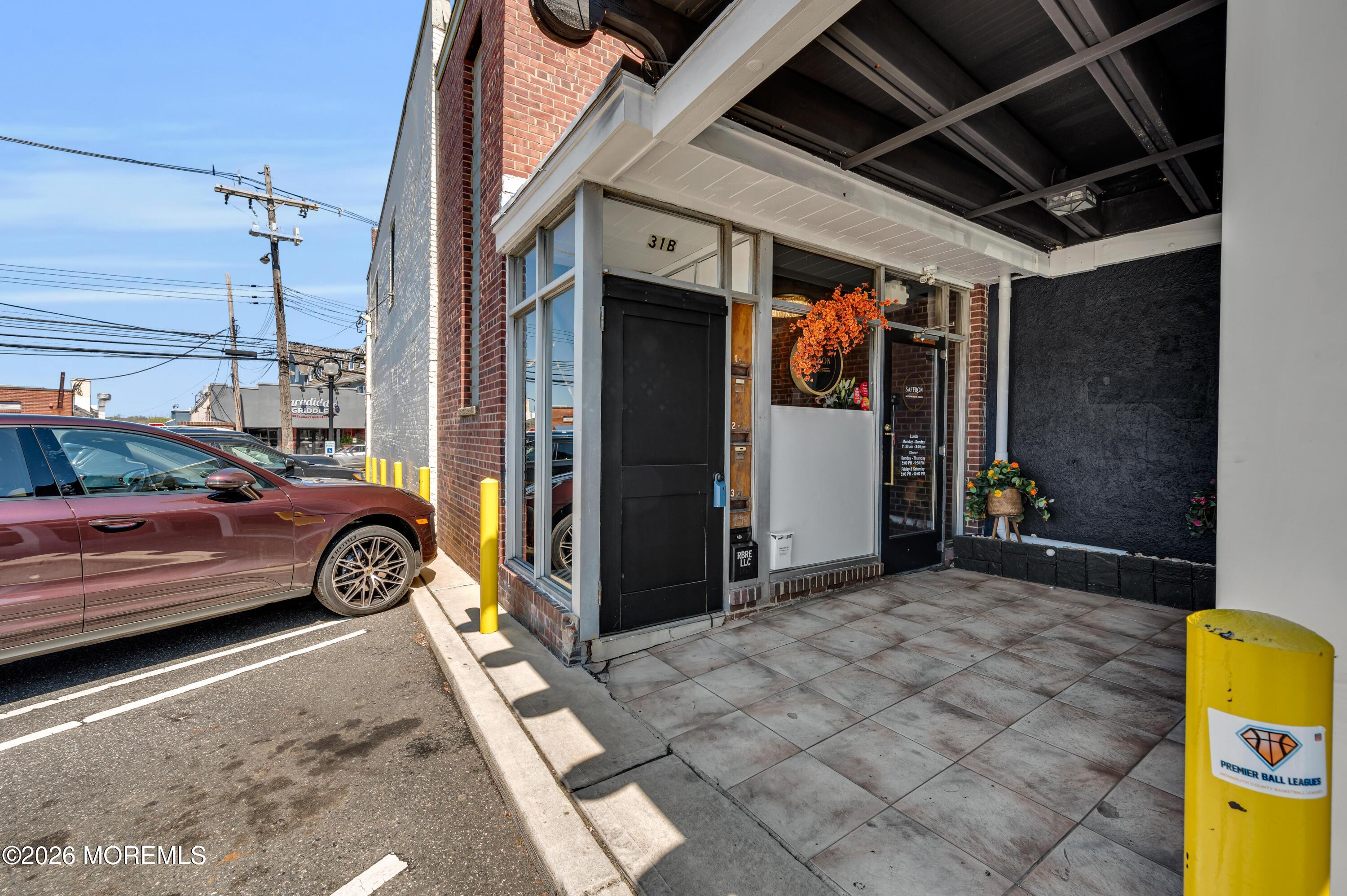 31-33 East Front Street, Unit 2 Red Bank, NJ 07701 - Photo 1 of 21 a view of car parked in garage