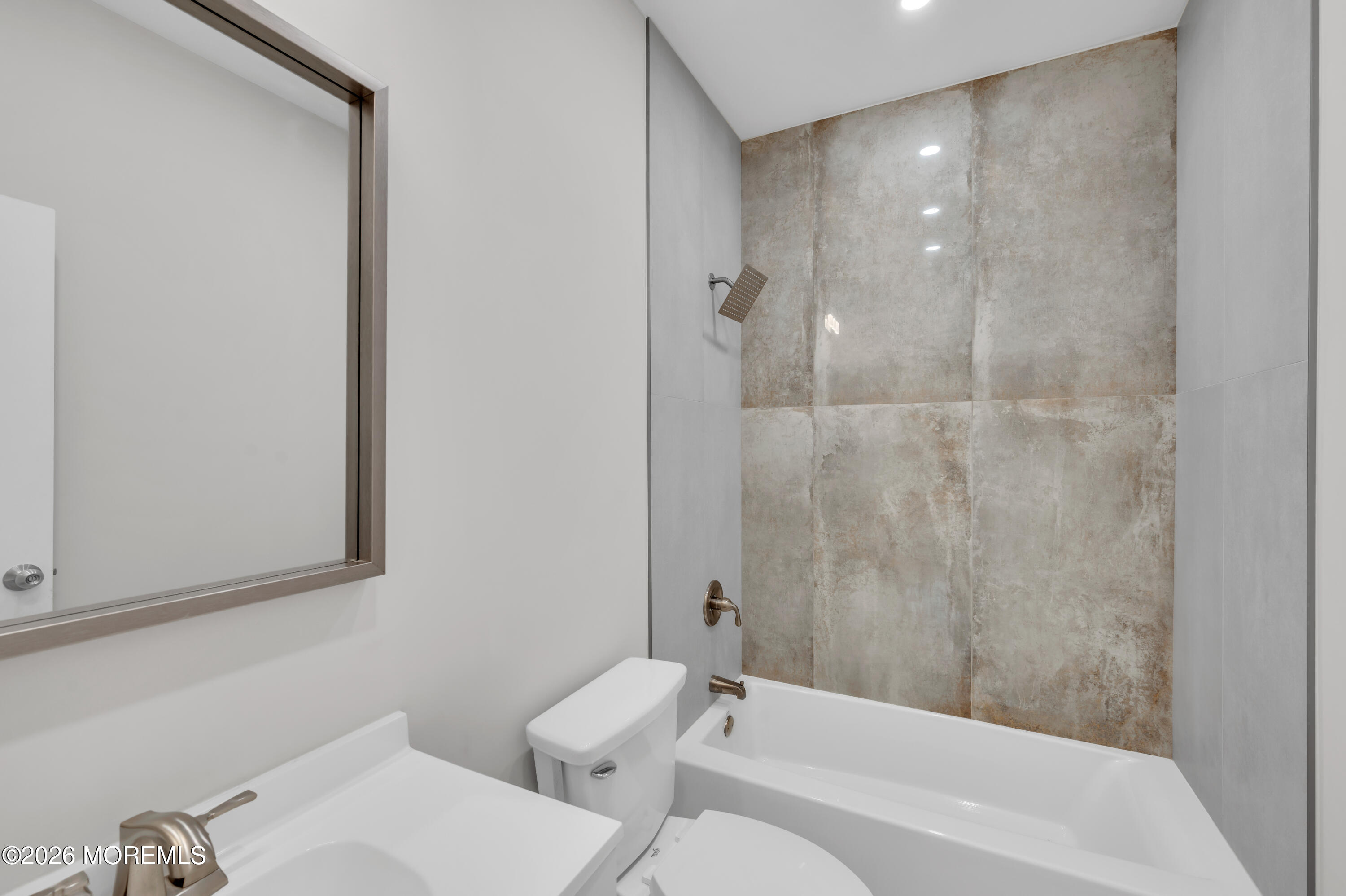 31-33 East Front Street, Unit 2 Red Bank, NJ 07701 - Photo 14 of 21 a bathroom with a bathtub and a toilet