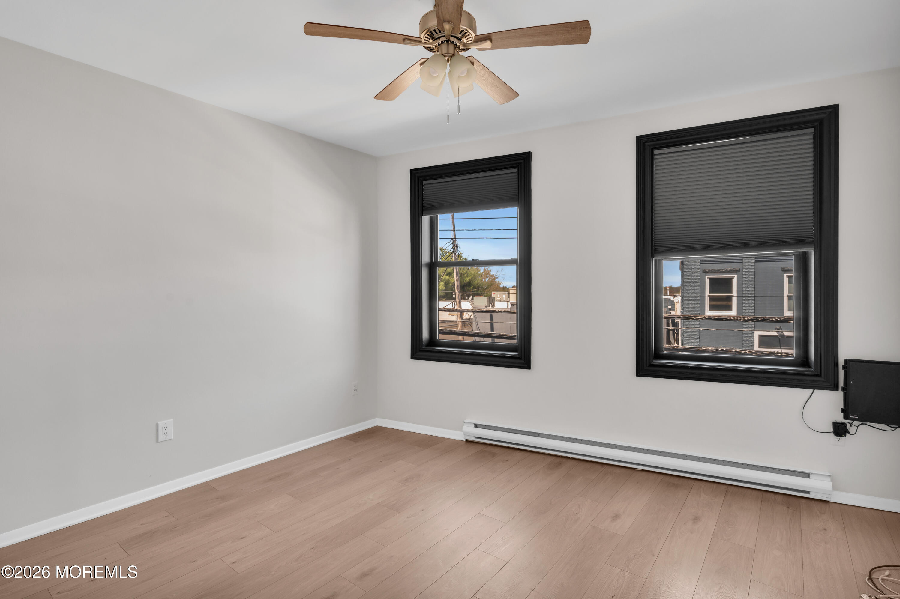 31-33 East Front Street, Unit 2 Red Bank, NJ 07701 - Photo 19 of 21 wooden floor in an empty room with a window