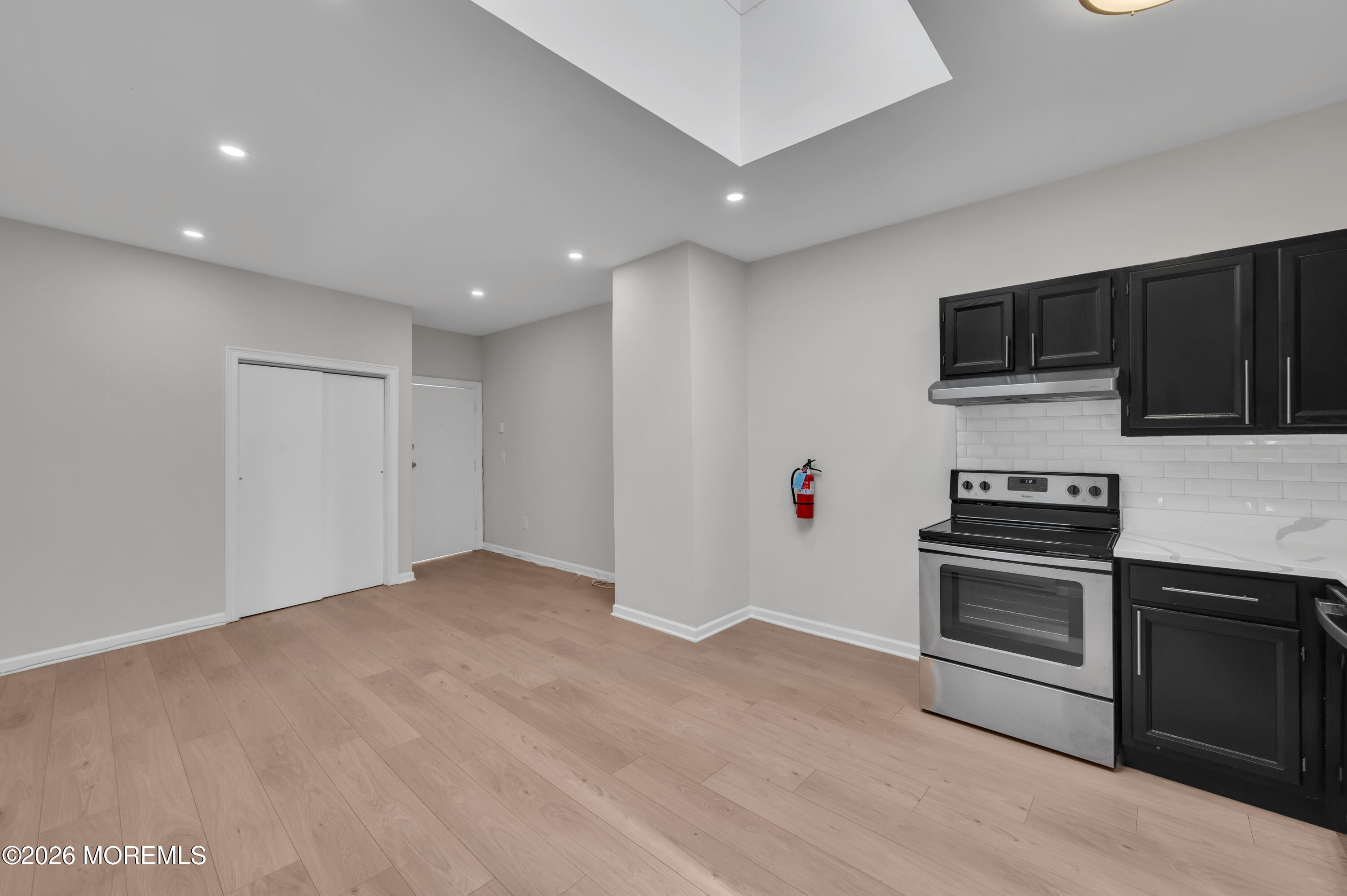 31-33 East Front Street, Unit 2 Red Bank, NJ 07701 - Photo 6 of 21 a view of kitchen with microwave and stove