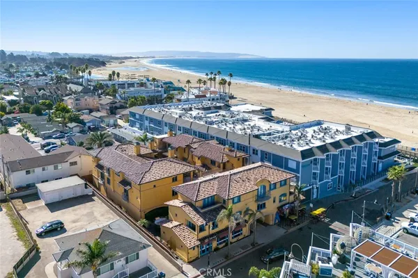 an aerial view of a house with a ocean view