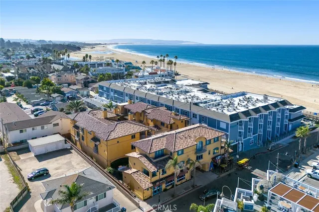 an aerial view of a house with a ocean view