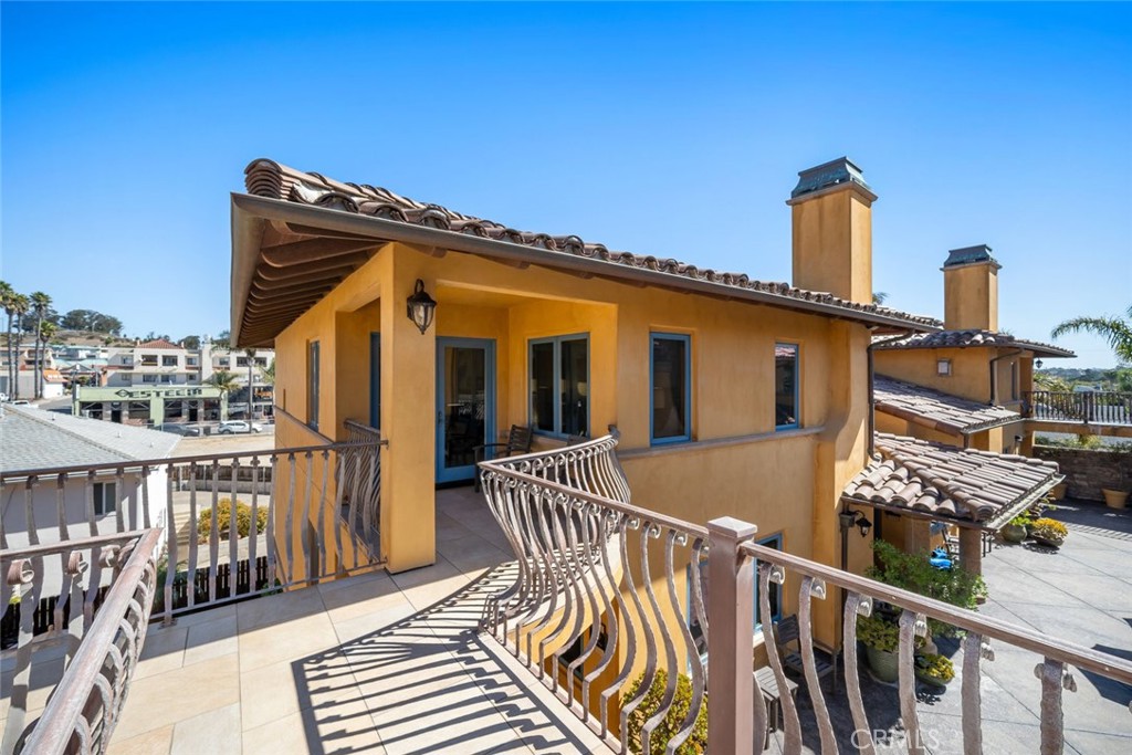 160 Hinds Avenue, Unit 202 Pismo Beach, CA 93449 - Photo 16 of 47 a front view of a house with parking space