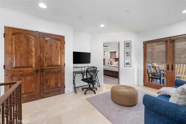 a livingroom with workspace and a couch