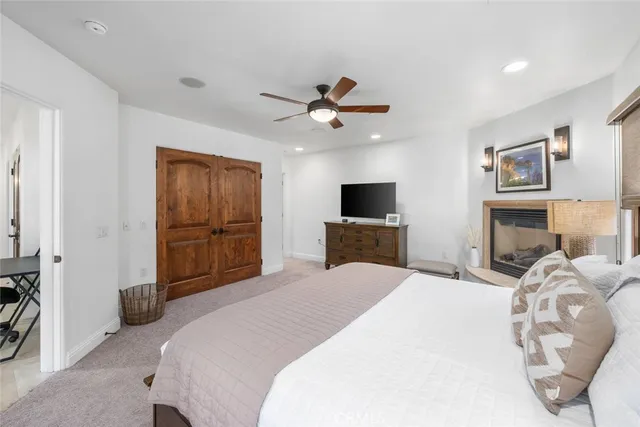 a bedroom with a bed and a television