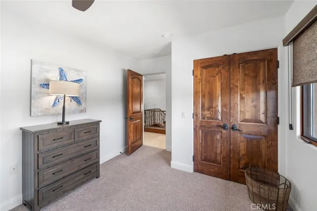 a view of a closet area with cabinets