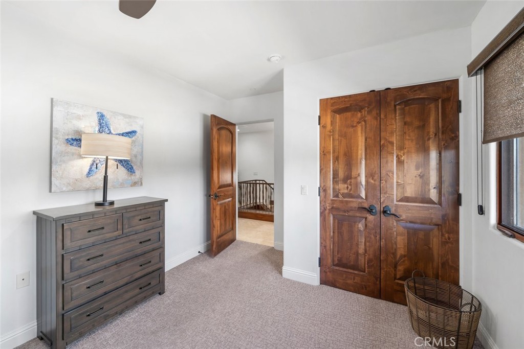 160 Hinds Avenue, Unit 202 Pismo Beach, CA 93449 - Photo 27 of 47 a view of a closet area with cabinets