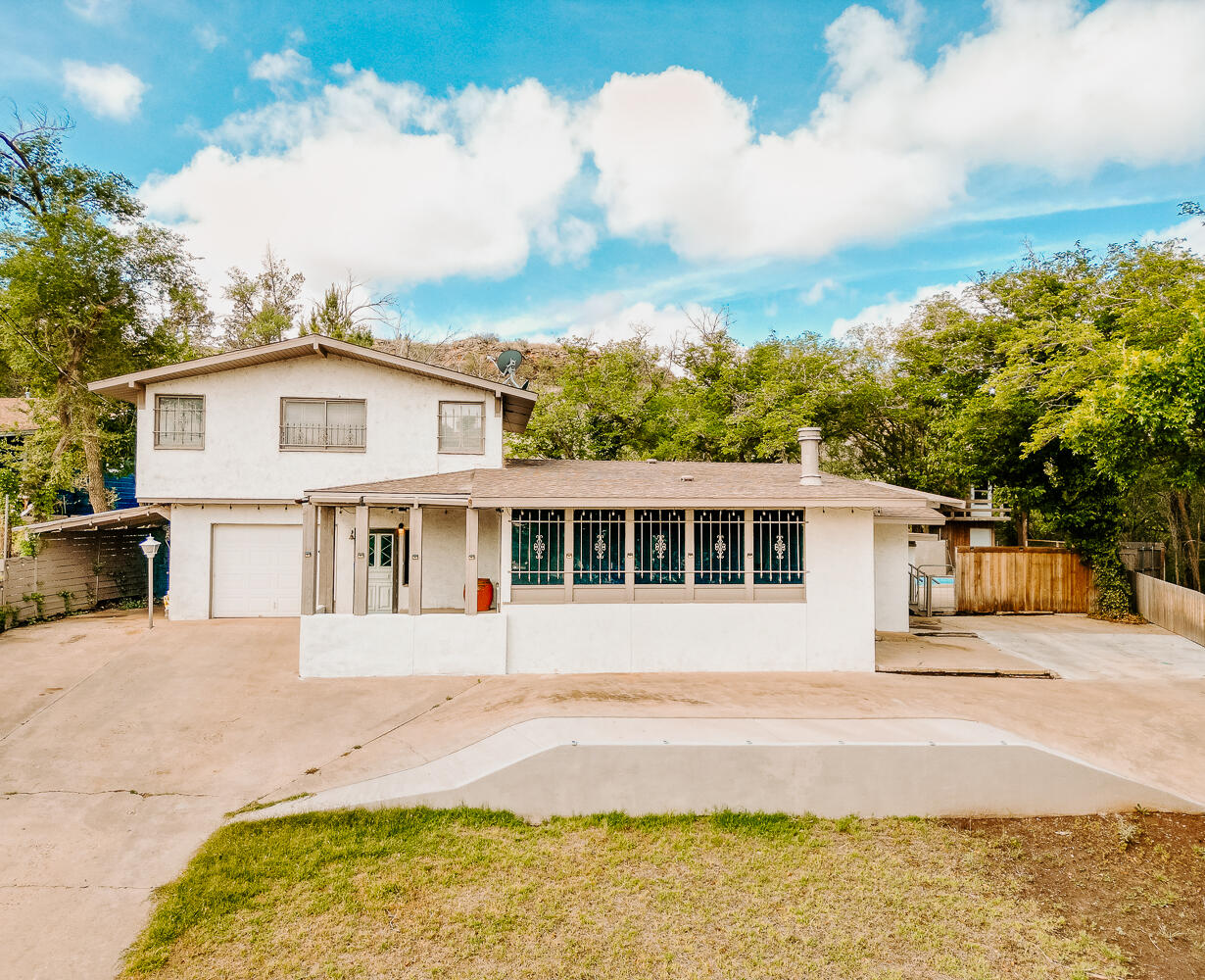 585 Comanche Drive Lubbock, TX 79404 - Photo 1 of 17 a view of house with yard and sitting area