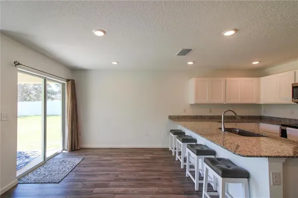 a kitchen with sink and window