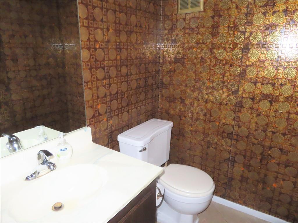 8801 Gatehouse Road, Unit 7 Plantation, FL 33324 - Photo 15 of 29 Downstairs half bath