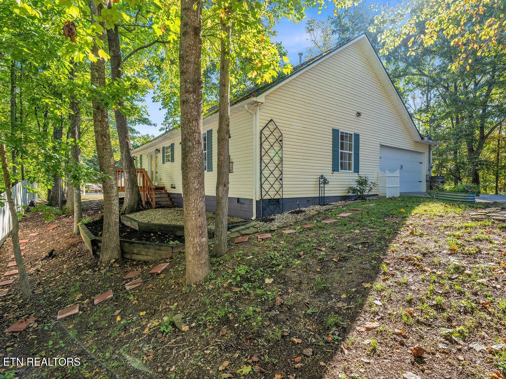 170 Cedar Circle Powell, TN 37849 - Photo 20 of 27 a view of a house with backyard and chairs