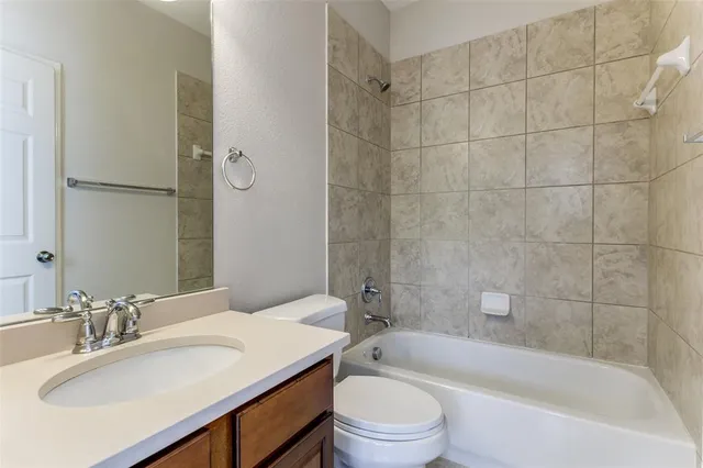 a bathroom with a sink toilet and bathtub