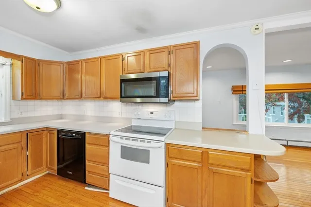 a kitchen with granite countertop a stove and a sink