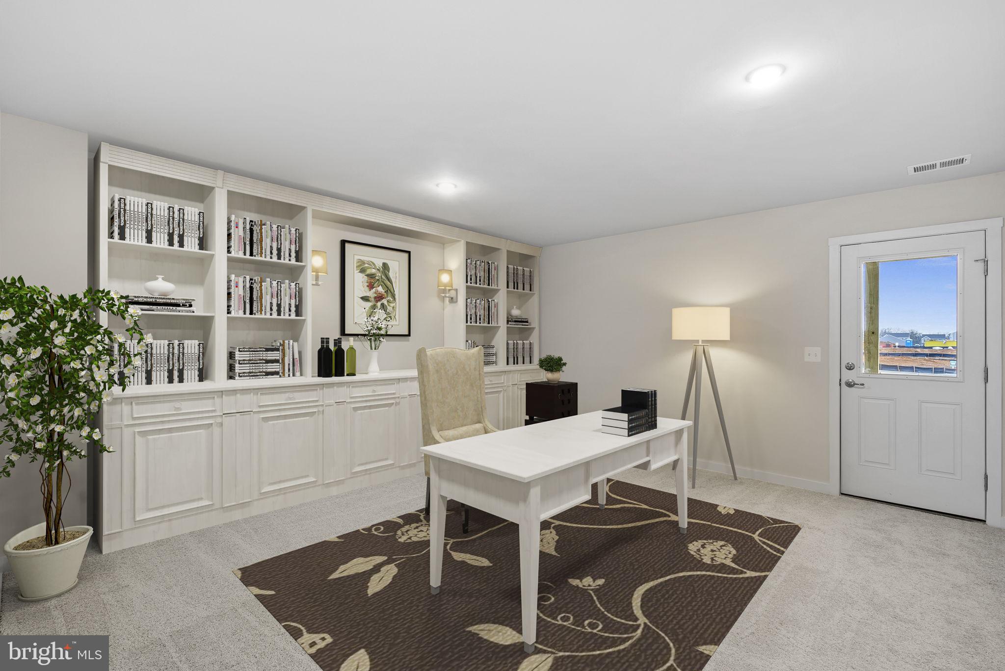 132 Huntwell W Avenue Ranson, WV 25438 - Photo 43 of 48 a view of a workspace with furniture and a potted plant