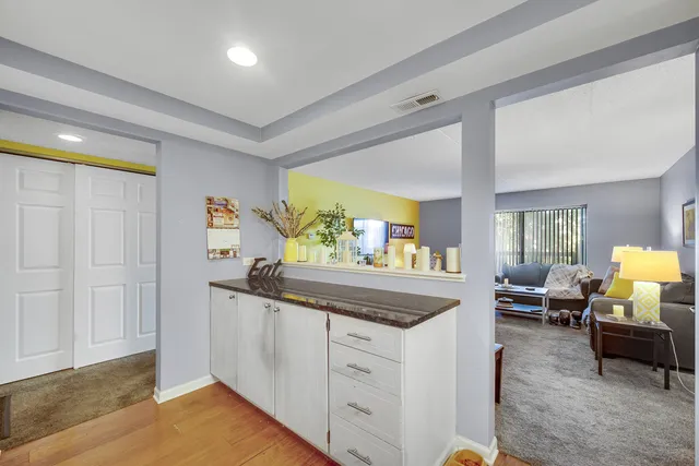 a kitchen with stainless steel appliances granite countertop a stove and a refrigerator