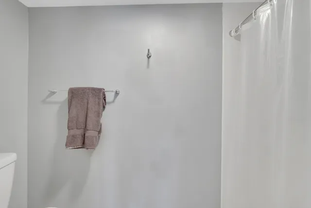 a bathroom with a shower curtain