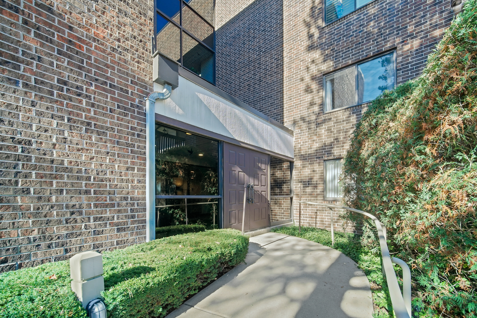 690 Chandler Road, Unit 302 Gurnee, IL 60031 - Photo 4 of 51 a view of a brick house with a yard