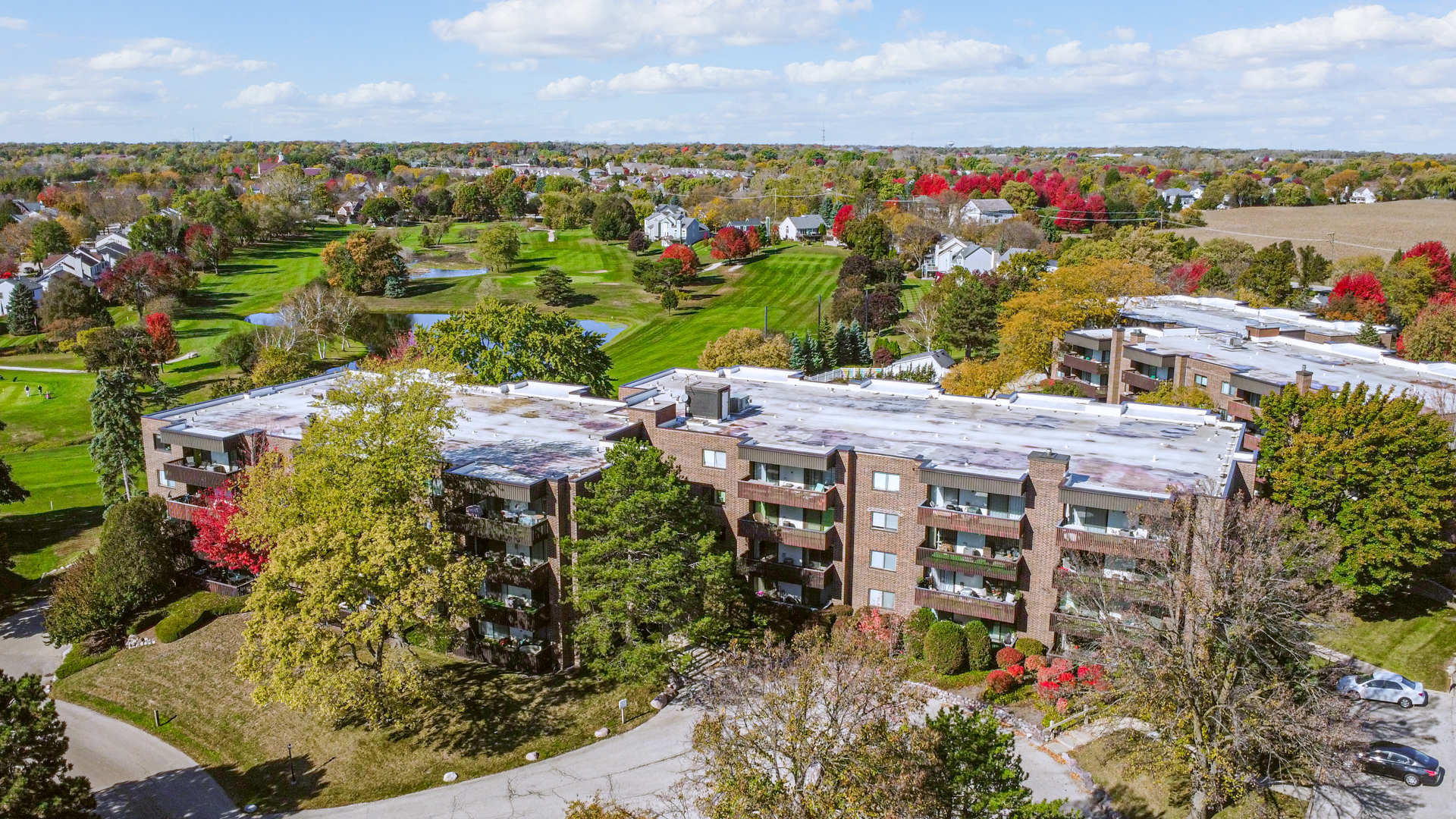 690 Chandler Road, Unit 302 Gurnee, IL 60031 - Photo 44 of 51 a view of a chairs and table in the backyard