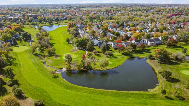 an aerial view of a house with a swimming pool