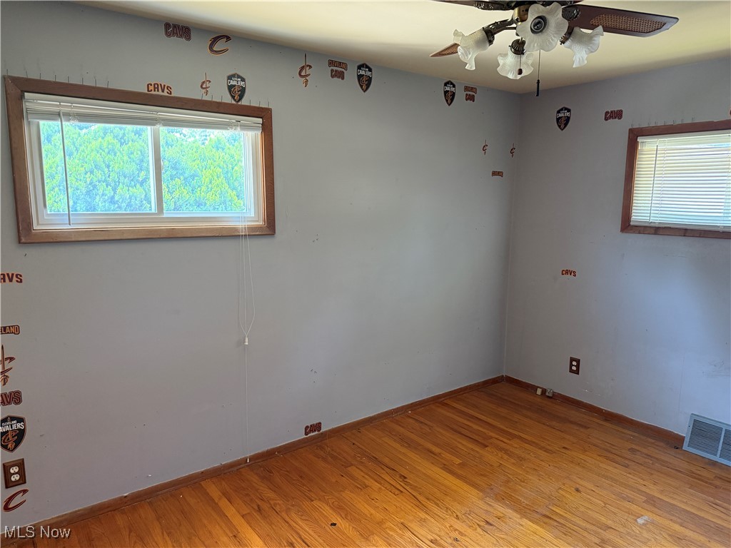 6350 Meadowbrook Road Garfield Heights, OH 44125 - Photo 22 of 28 Spare room featuring light wood-style flooring and ceiling fan