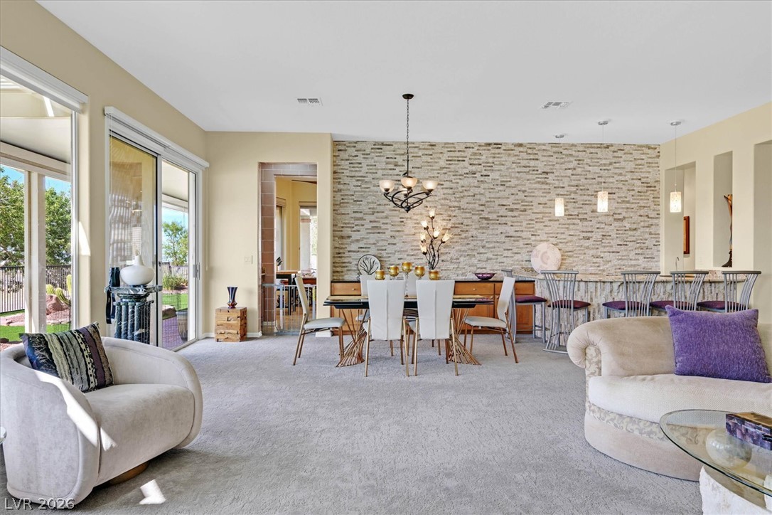 1823 Baton Rouge Street Henderson, NV 89052 - Photo 57 of 60 An open floorplan connects the living spaces under high ceilings and sliding glass doors.
