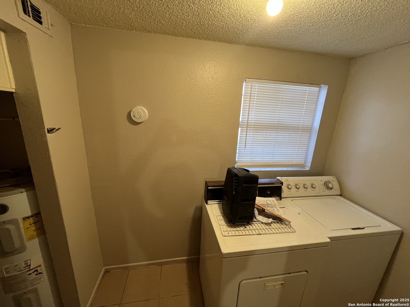 222 Audrey Alene Drive, Unit 2 San Antonio, TX 78216 - Photo 3 of 11 a utility room with dryer and washer