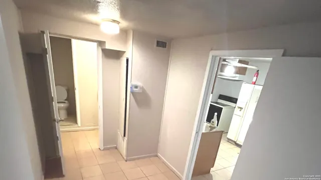 a view of bathroom with a sink and a mirror