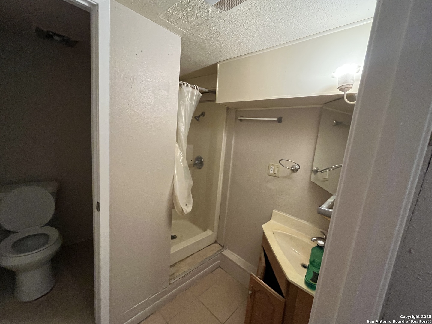 222 Audrey Alene Drive, Unit 2 San Antonio, TX 78216 - Photo 10 of 11 a bathroom with a toilet and a shower