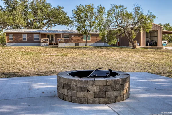 a view of house with a yard