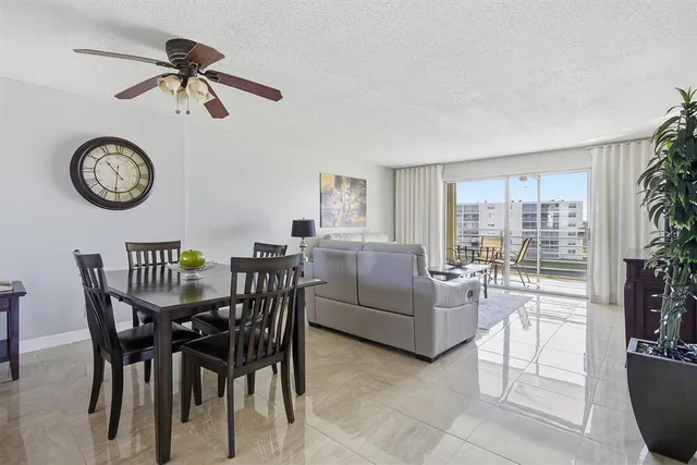 a dining room with furniture clock and a rug