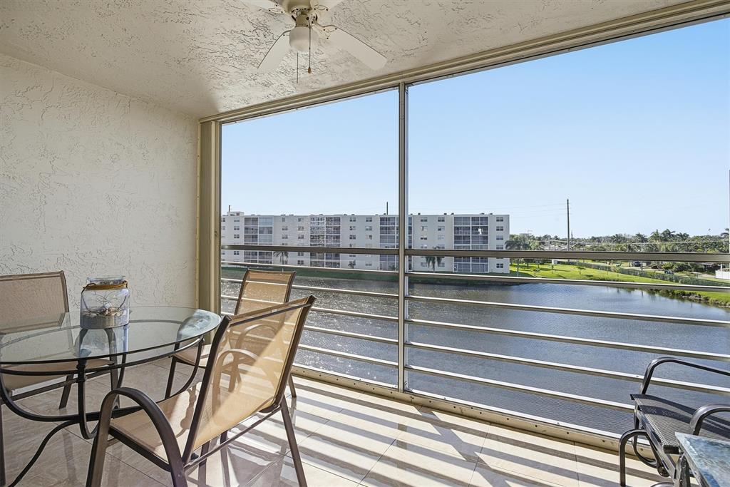 311 Southeast 3rd Street, Unit 410 Dania Beach, FL 33004 - Photo 16 of 51 a view of a living room with furniture and floor to ceiling window