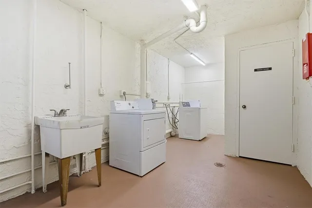 a utility room with closet dryer and washer