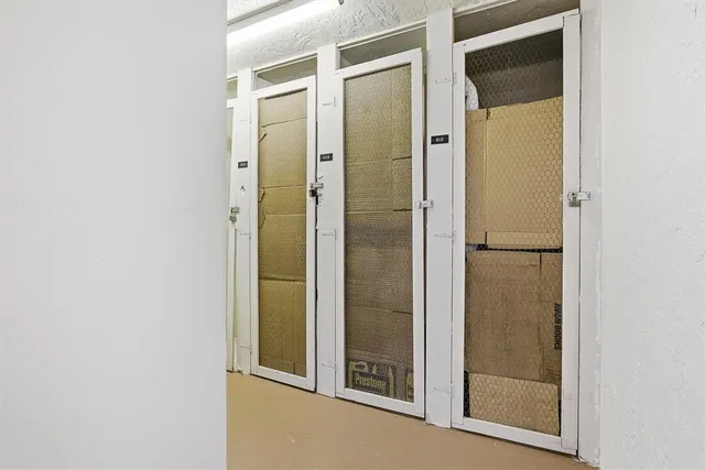 a bathroom with a glass shower door