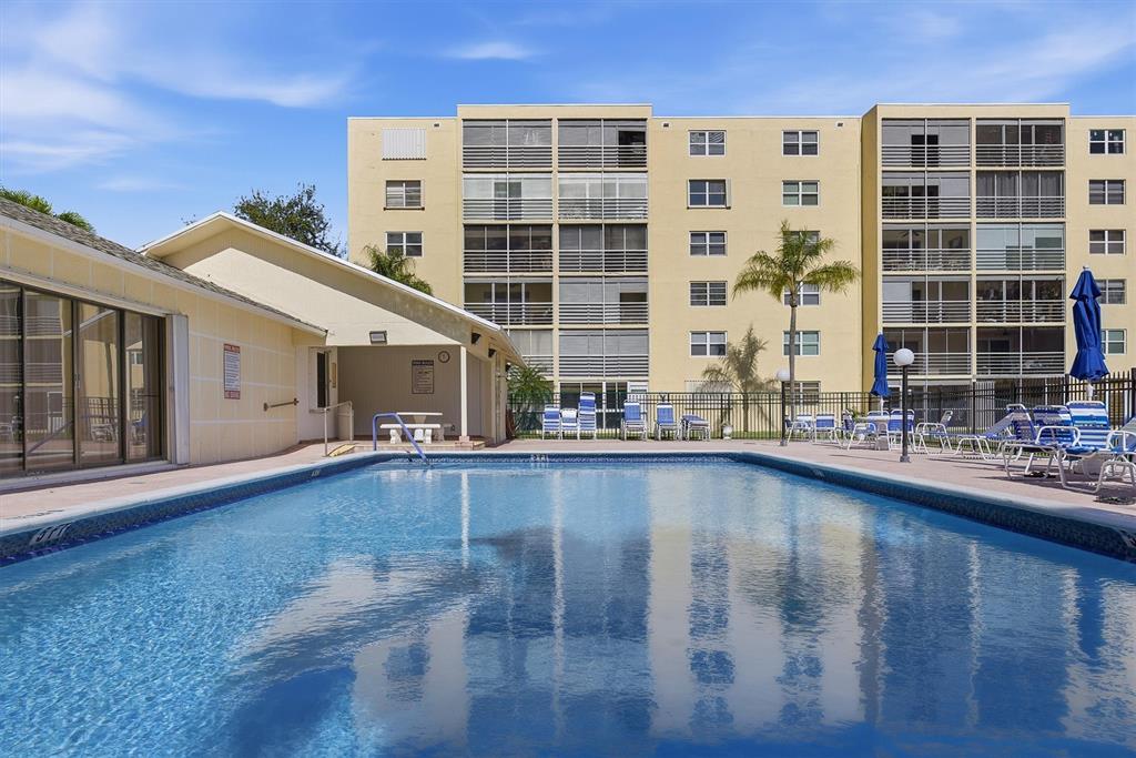 311 Southeast 3rd Street, Unit 410 Dania Beach, FL 33004 - Photo 31 of 51 a front view of a house with swimming pool