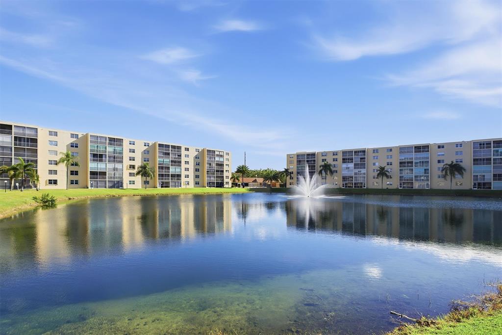 311 Southeast 3rd Street, Unit 410 Dania Beach, FL 33004 - Photo 33 of 51 a view of a lake with building in front of it