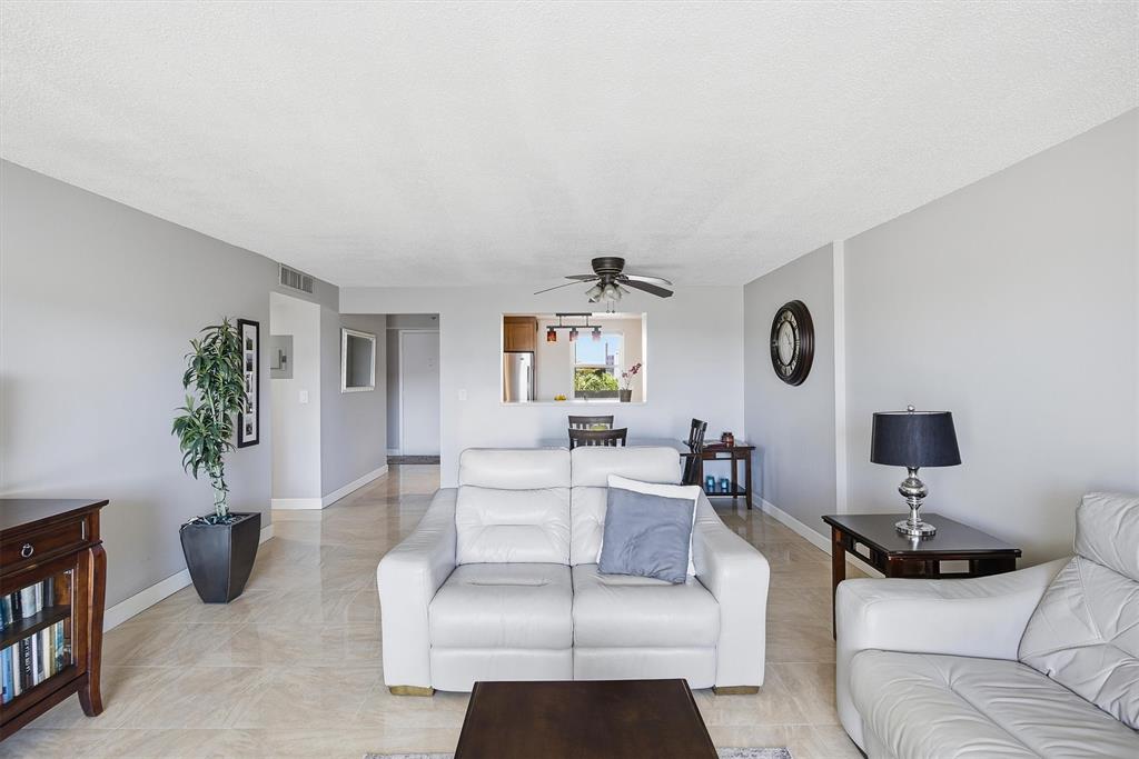311 Southeast 3rd Street, Unit 410 Dania Beach, FL 33004 - Photo 10 of 51 a living room with furniture and a wooden floor
