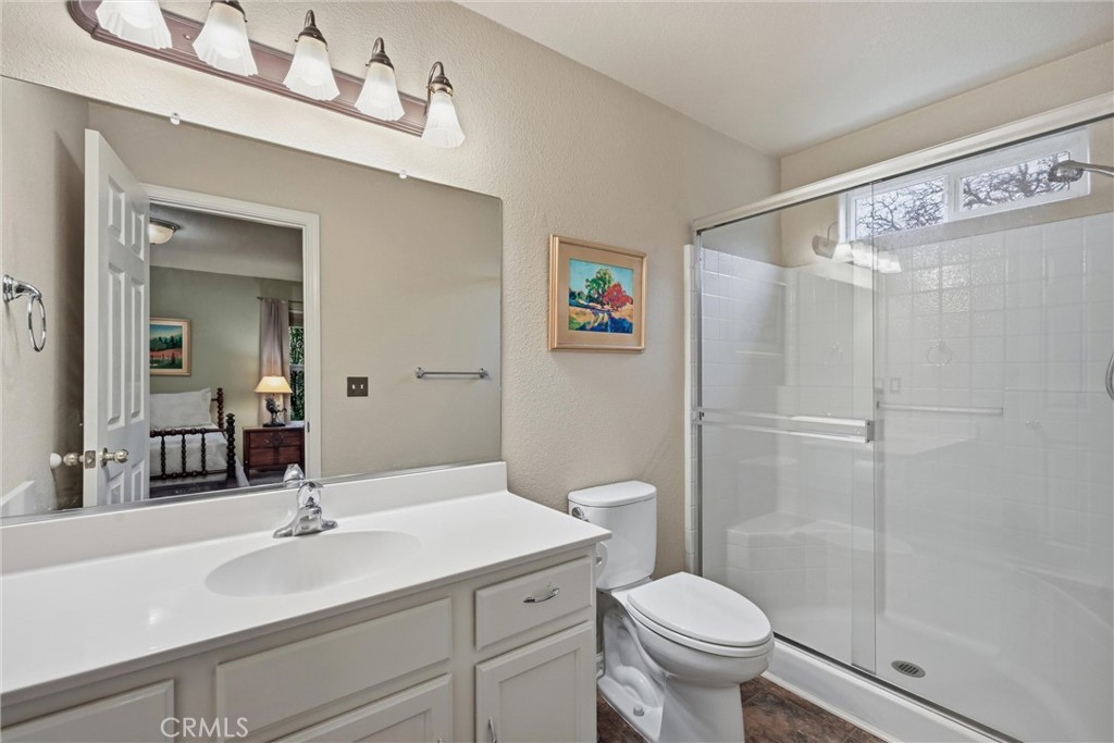 19072 Hidden Valley Road Hidden Valley Lake, CA 95467 - Photo 13 of 27 a bathroom with a sink a toilet a mirror and shower
