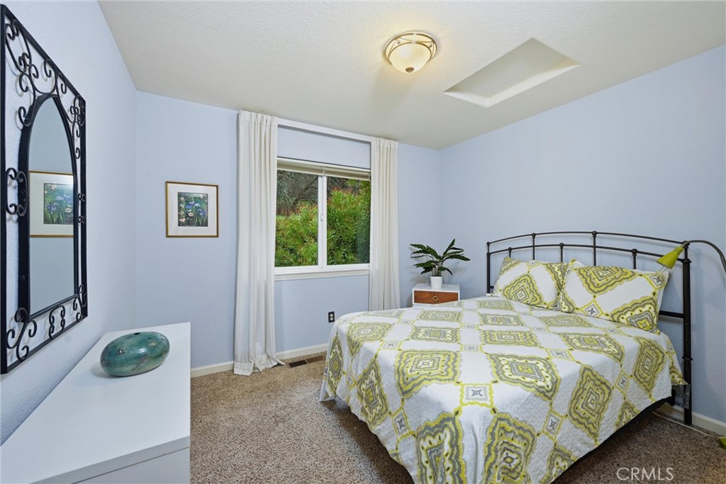 19072 Hidden Valley Road Hidden Valley Lake, CA 95467 - Photo 14 of 27 a bedroom with a bed and a window
