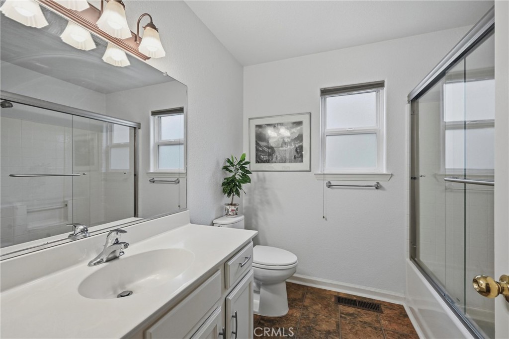 19072 Hidden Valley Road Hidden Valley Lake, CA 95467 - Photo 15 of 27 a bathroom with a sink a toilet and shower