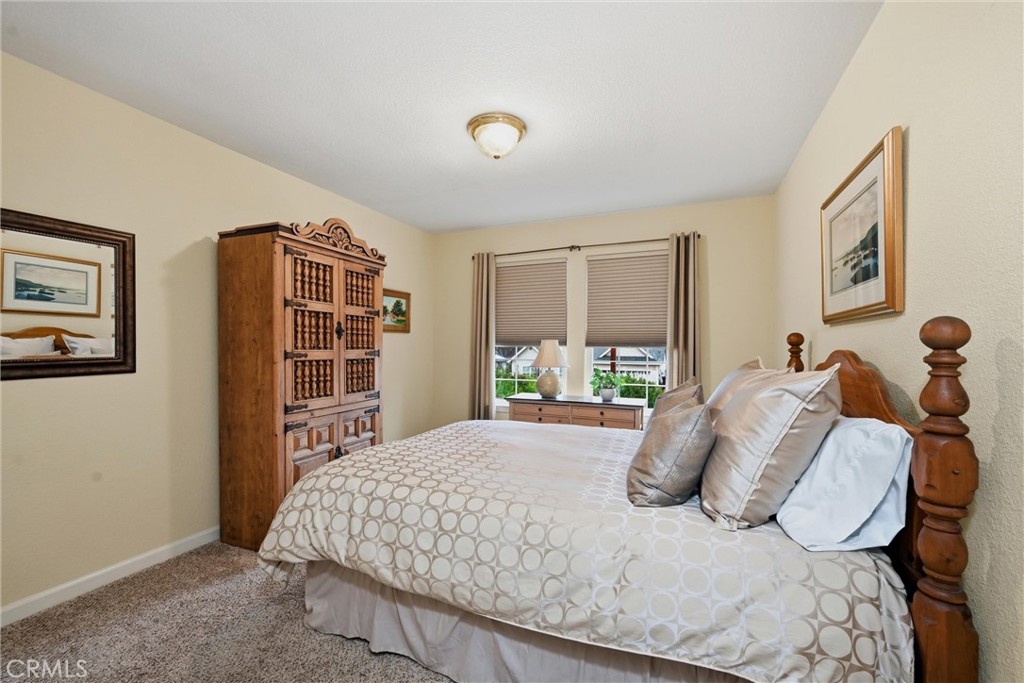 19072 Hidden Valley Road Hidden Valley Lake, CA 95467 - Photo 16 of 27 a bedroom with a large bed and a window