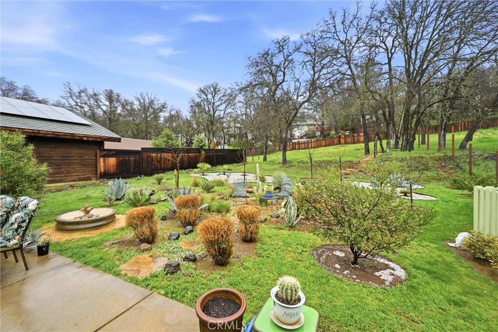 19072 Hidden Valley Road Hidden Valley Lake, CA 95467 - Photo 19 of 27 a view of backyard of house with seating space and trees in the background