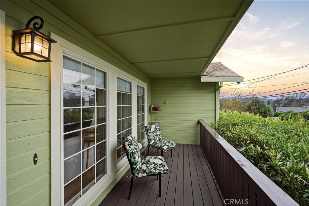 19072 Hidden Valley Road Hidden Valley Lake, CA 95467 - Photo 24 of 27 a view of a balcony with chairs and a potted plant