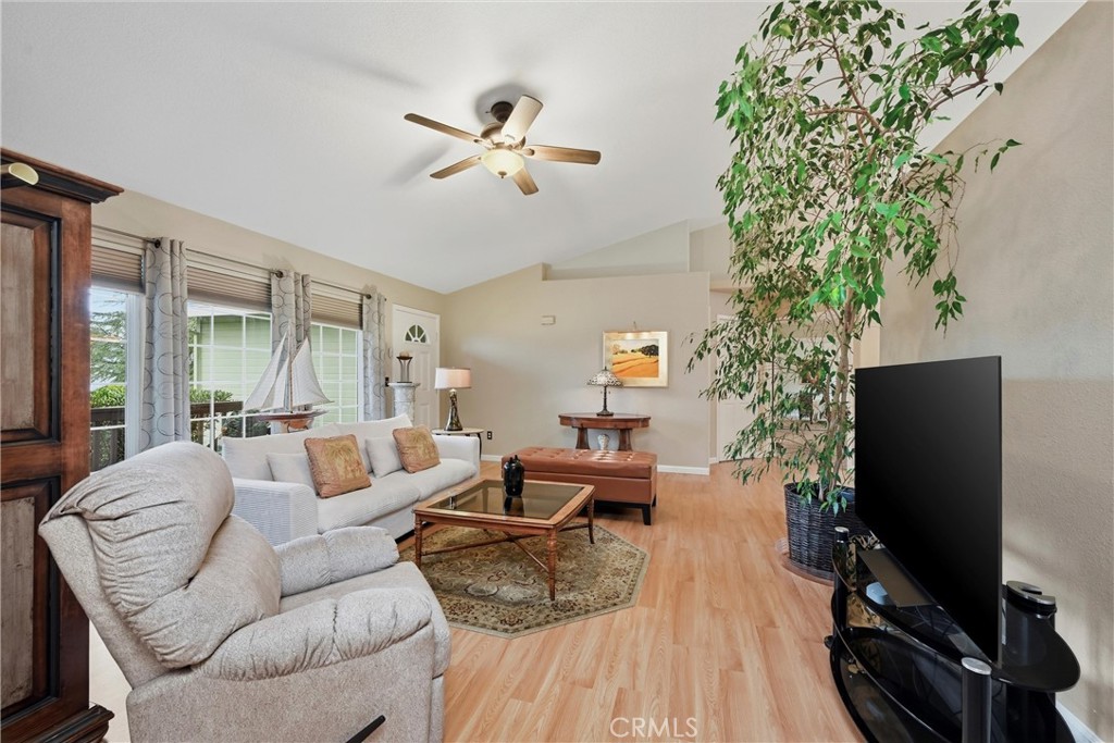 19072 Hidden Valley Road Hidden Valley Lake, CA 95467 - Photo 4 of 27 a living room with furniture a large window and a flat screen tv
