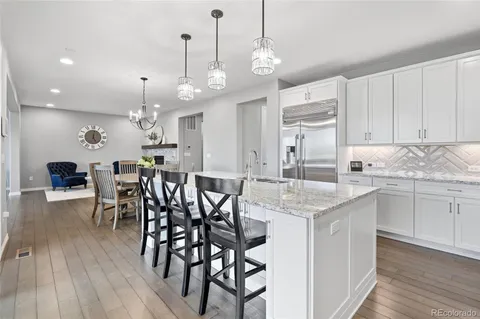 a view of room with wooden floor