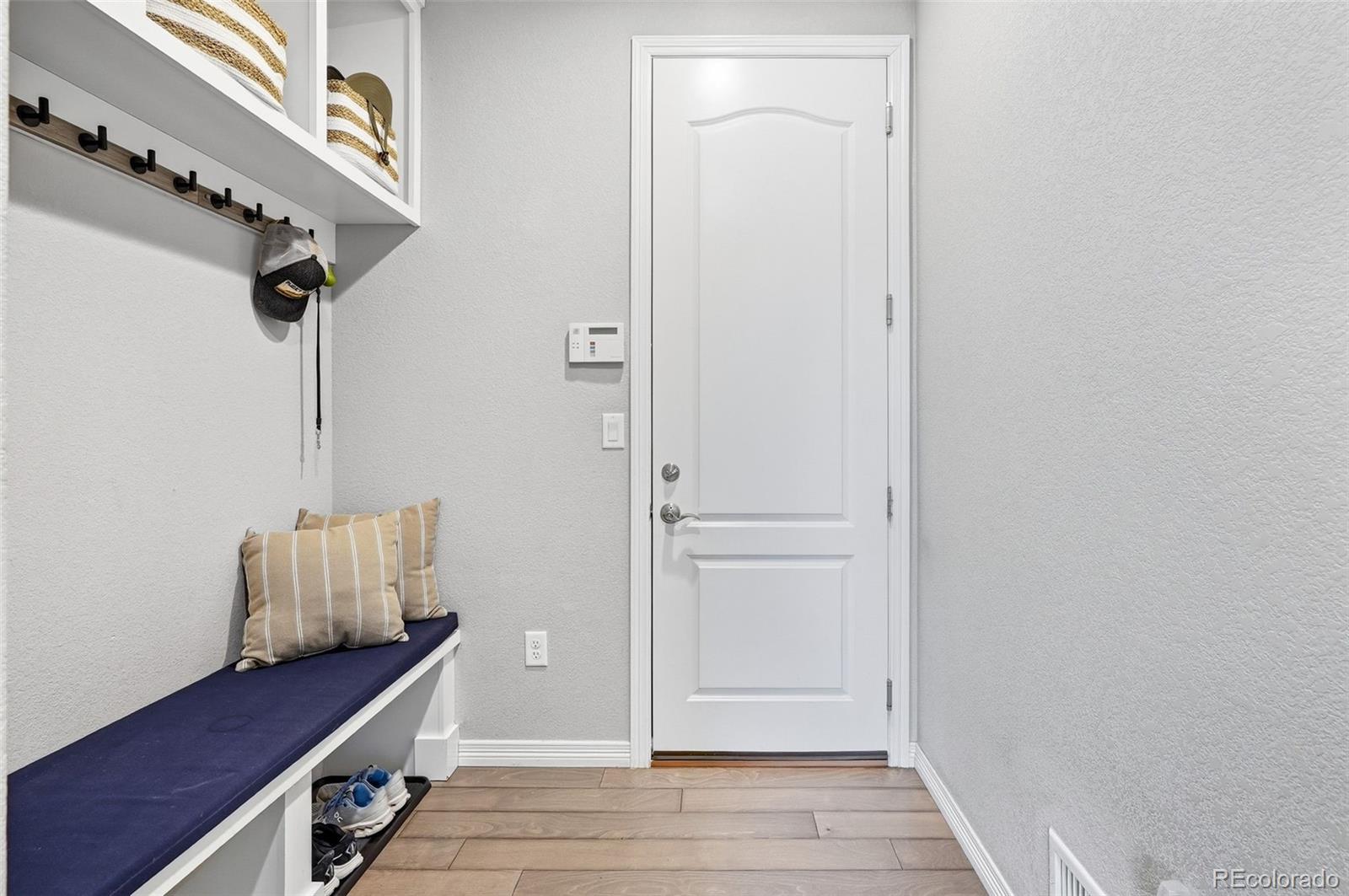769 Winding Pine Lane Highlands Ranch, CO 80126 - Photo 19 of 50 a view of room with wooden floor