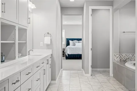 a bathroom with a tub and a window