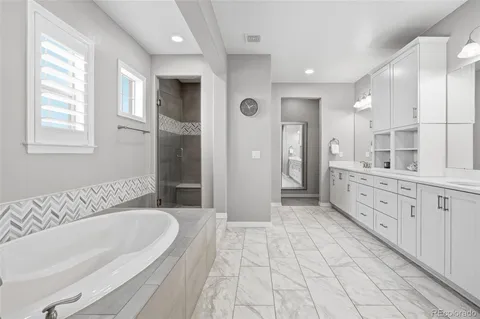 a bathroom with a glass shower door