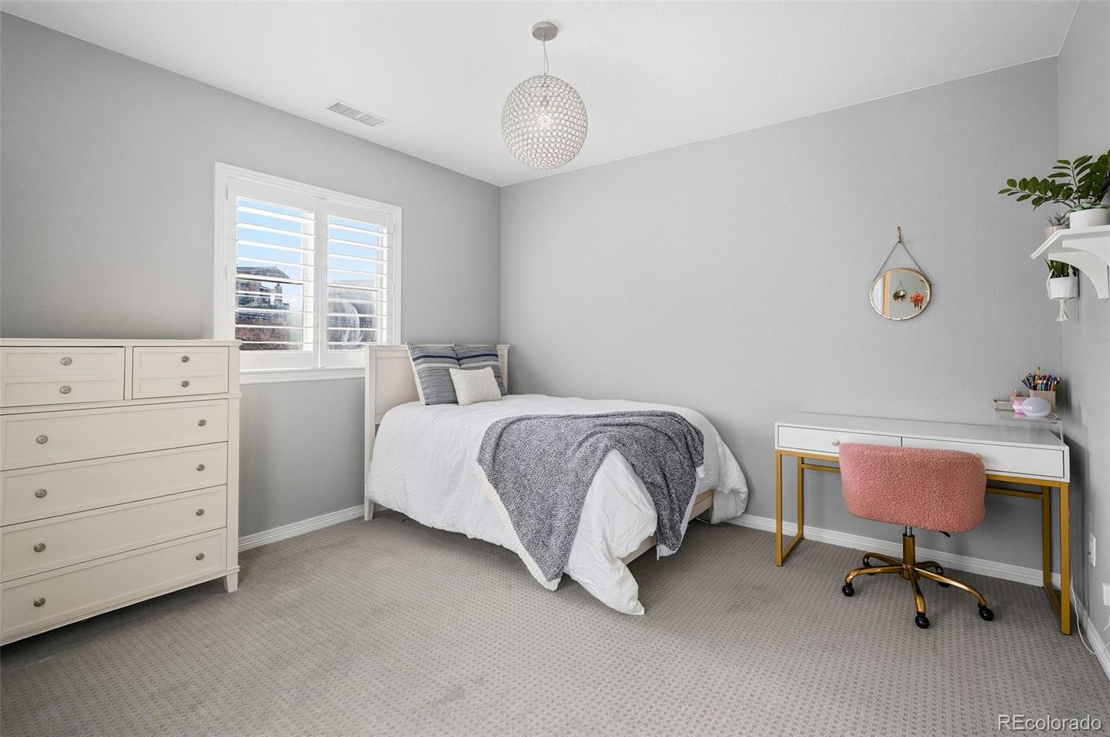 769 Winding Pine Lane Highlands Ranch, CO 80126 - Photo 37 of 50 a bedroom with a bed and a desk